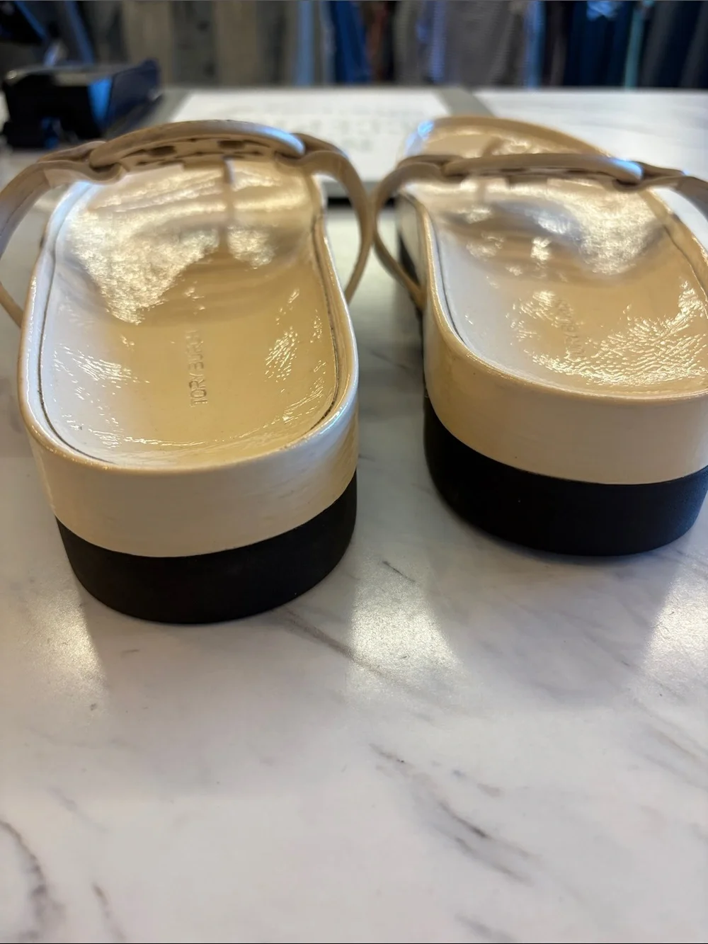 Tory Burch Patent Logo Thong Sandals in Light Beige with a chunky heel.